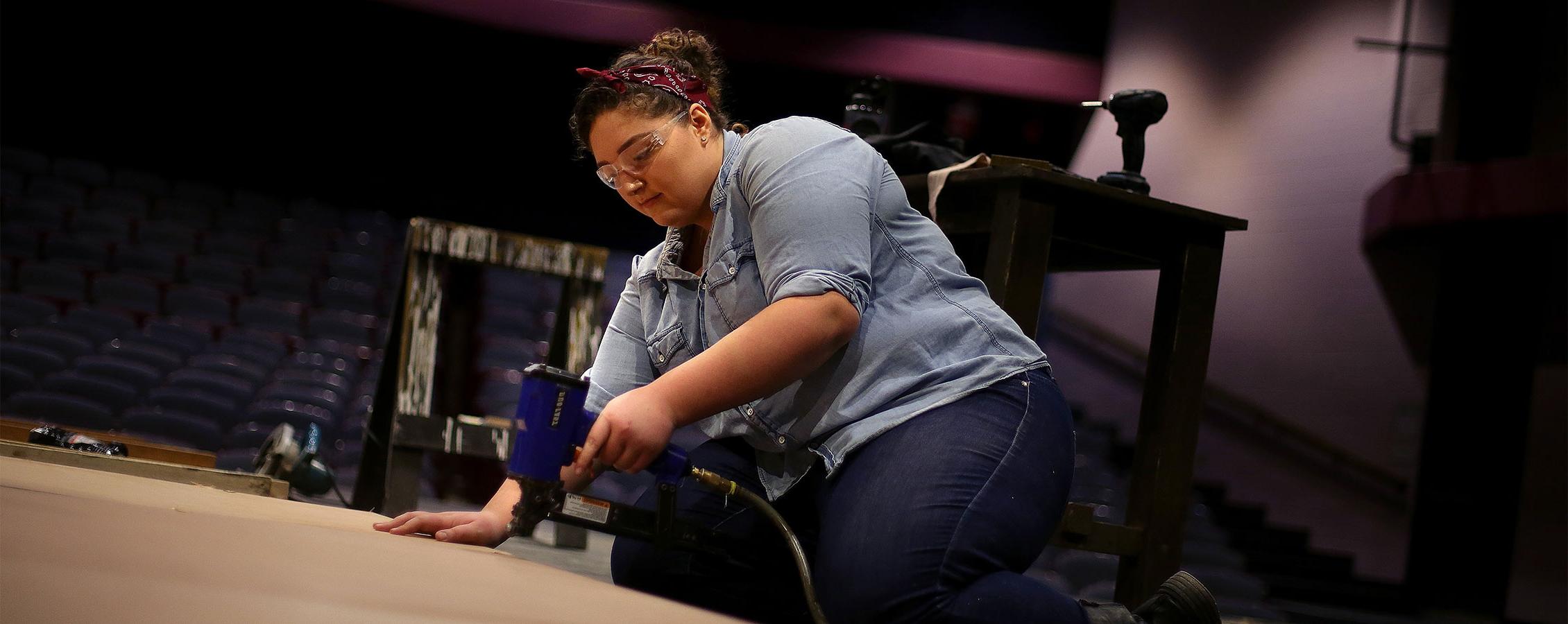 Theatre major creates a set for a play on the University of Wisconsin Whitewater campus.