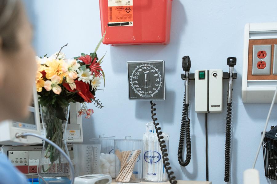 Medical equipment hangs on a wall.